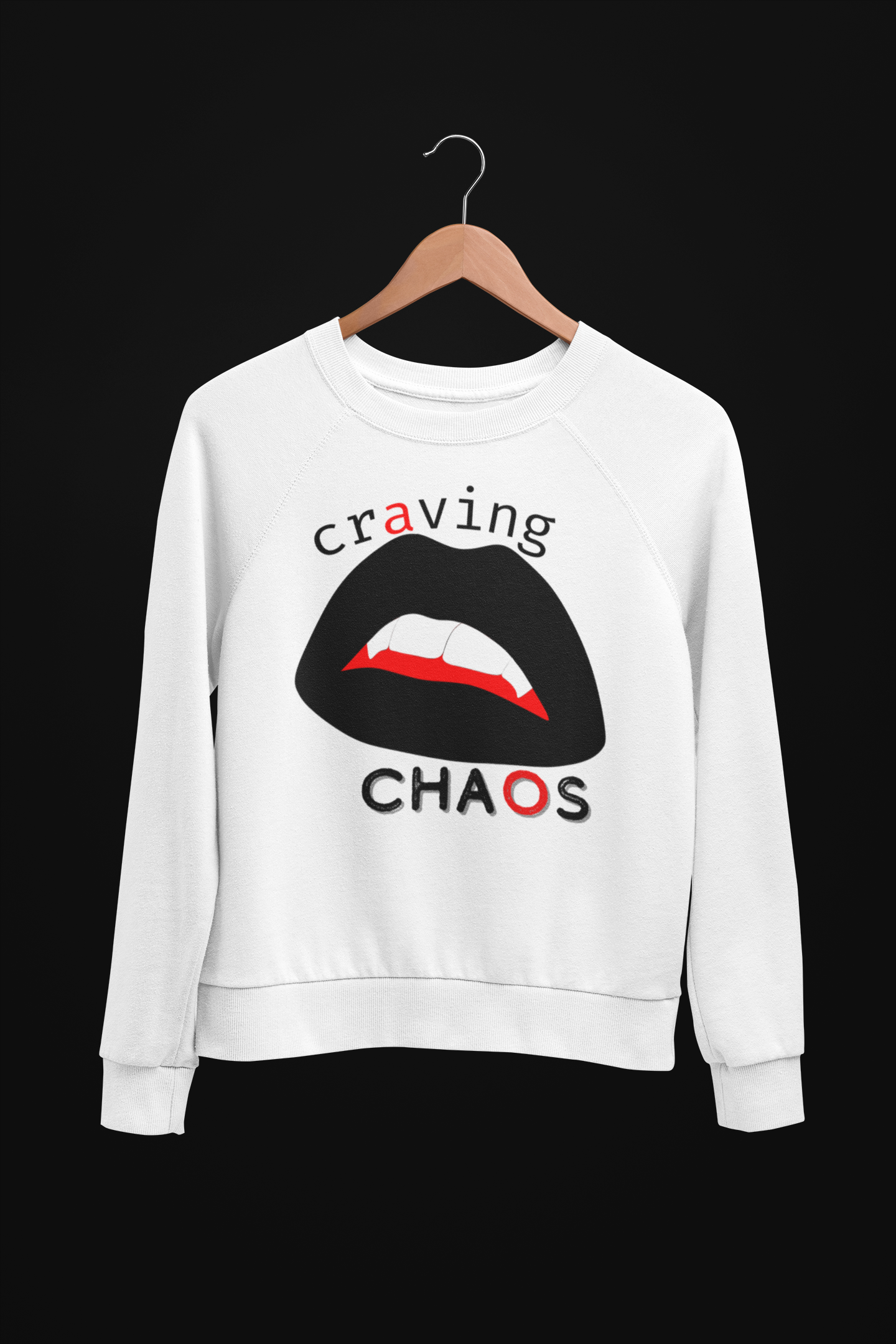 White sweatshirt with graphic design of lips and text 'craving CHAOS' on a black background