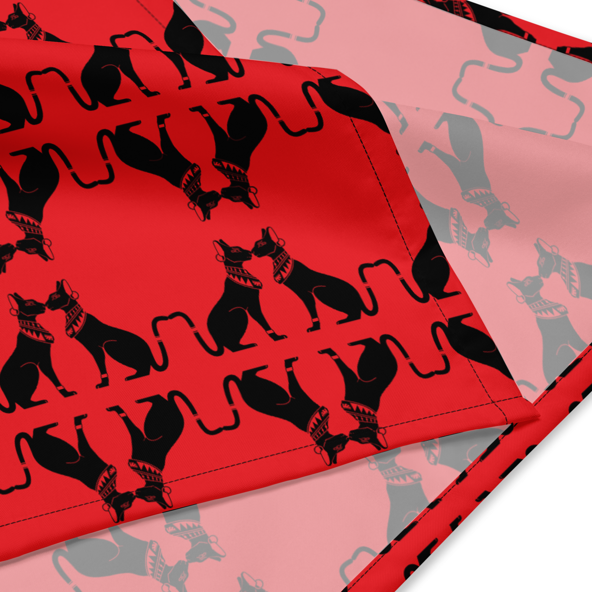 Red fabric with black cat pattern