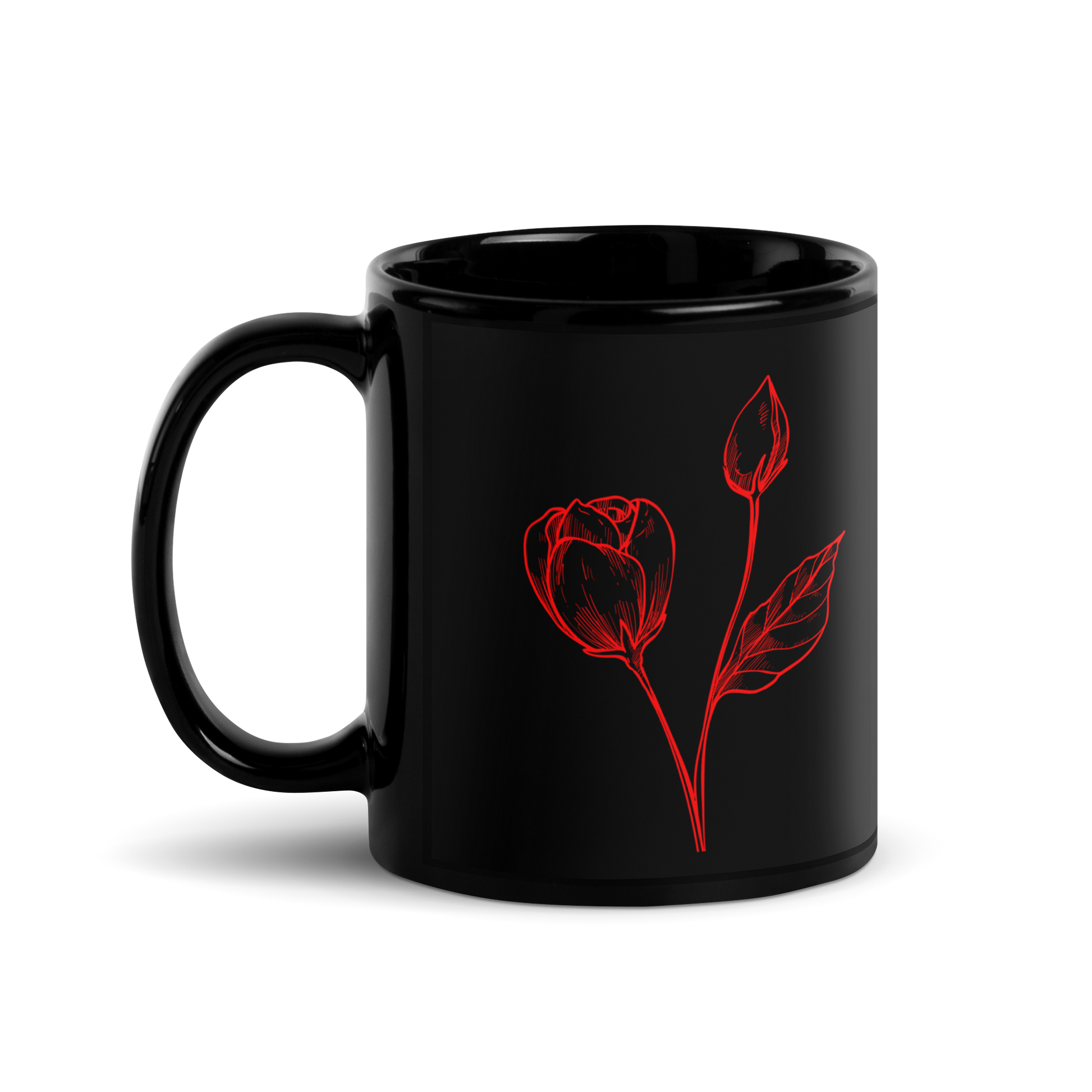 Black mug with red rose design on a white background